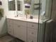 Bathroom vanity with white cabinets, a white countertop, and a glass door shower at 13779 Sw 111Th Ave, Dunnellon, FL 34432