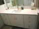 Bathroom vanity featuring white cabinets, a white countertop, and a sink at 13779 Sw 111Th Ave, Dunnellon, FL 34432