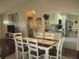 Bright dining room showcases modern table and seating flowing to the kitchen at 13779 Sw 111Th Ave, Dunnellon, FL 34432