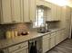 Modern kitchen with white cabinets and granite countertops at 13779 Sw 111Th Ave, Dunnellon, FL 34432