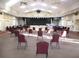 Large meeting room with ample seating and a stage at 13779 Sw 111Th Ave, Dunnellon, FL 34432