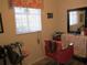 Bright, airy salon room with large window, mirror, and hair styling station at 13779 Sw 111Th Ave, Dunnellon, FL 34432