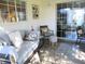 Relaxing screened porch with tiled floor and comfy seating at 13779 Sw 111Th Ave, Dunnellon, FL 34432