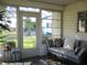 Relaxing sun room with plentiful natural light, neutral decor, a daybed, and a view of the outdoors at 13779 Sw 111Th Ave, Dunnellon, FL 34432