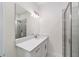 Modern bathroom with single vanity, quartz countertop and shower at 13824 Se 42 Ave, Summerfield, FL 34491