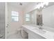 Clean bathroom with single vanity, quartz countertop, and toilet at 13824 Se 42 Ave, Summerfield, FL 34491