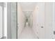 Bright hallway with light tile floors and neutral walls at 13824 Se 42 Ave, Summerfield, FL 34491