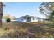 Backyard view of light blue house at 13824 Se 42 Ave, Summerfield, FL 34491