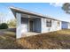 Light blue house exterior with covered patio at 13824 Se 42 Ave, Summerfield, FL 34491