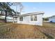 Light blue single story house with a spacious yard at 13824 Se 42 Ave, Summerfield, FL 34491