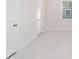 Bright interior room with white walls and tile flooring at 13824 Se 42 Ave, Summerfield, FL 34491