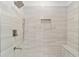 Spa-like shower with modern fixtures and a built-in seat at 13824 Se 42 Ave, Summerfield, FL 34491