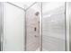 Contemporary shower with modern fixtures and pebble floor at 13824 Se 42 Ave, Summerfield, FL 34491