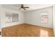 Well lit bedroom with wood floors and window coverings at 13957 Se 86Th Cir, Summerfield, FL 34491