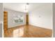 Bright dining area with wood floors and built-in shelving at 13957 Se 86Th Cir, Summerfield, FL 34491