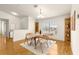 Dining room with wood floors and built-in shelving at 13957 Se 86Th Cir, Summerfield, FL 34491