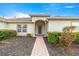 House entrance with a brick walkway and well-maintained landscaping at 13957 Se 86Th Cir, Summerfield, FL 34491