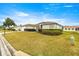 Ranch style home with landscaped yard and driveway at 13957 Se 86Th Cir, Summerfield, FL 34491