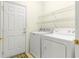 Laundry room with washer, dryer, and shelving at 13957 Se 86Th Cir, Summerfield, FL 34491