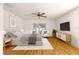 Main bedroom with wood floors and ceiling fan at 13957 Se 86Th Cir, Summerfield, FL 34491