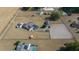 Aerial view showing home, pool, barn, and riding arena on a large lot at 14130 Sw 8Th Ave, Ocala, FL 34473