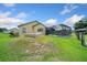 Well-maintained backyard features a screened-in pool and ample green space at 14130 Sw 8Th Ave, Ocala, FL 34473