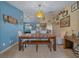 Bright dining area with a wooden table, bench, and horse-themed decor at 14130 Sw 8Th Ave, Ocala, FL 34473