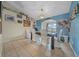 Bright dining room with neutral tile floors and elegant decor and views of the lawn at 14130 Sw 8Th Ave, Ocala, FL 34473