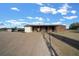 Exterior view of a barn with metal roof and wooden siding at 14130 Sw 8Th Ave, Ocala, FL 34473