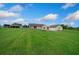 Home with a metal roof and large front yard, showcasing its picturesque setting at 14130 Sw 8Th Ave, Ocala, FL 34473