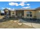 Home exterior featuring a welcoming front porch and stone accents at 14130 Sw 8Th Ave, Ocala, FL 34473