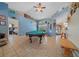 Spacious game room featuring a pool table, tile flooring, and stylish decor at 14130 Sw 8Th Ave, Ocala, FL 34473