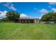 The property features a horse barn with multiple stalls, offering ample space for equestrian activities at 14130 Sw 8Th Ave, Ocala, FL 34473