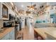 Kitchen features stainless steel appliances and light blue cabinets at 14130 Sw 8Th Ave, Ocala, FL 34473