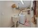 Bright laundry room with shelving and built in sink at 14130 Sw 8Th Ave, Ocala, FL 34473