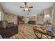 Spacious living room with dark leather furniture at 14130 Sw 8Th Ave, Ocala, FL 34473