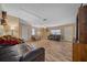 Living Room with leather couches and wood-look floors at 14130 Sw 8Th Ave, Ocala, FL 34473