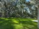 Lush backyard with healthy green grass, perfect for outdoor activities and relaxation at 14268 Se 27Th Ct, Summerfield, FL 34491