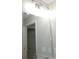 Bright bathroom featuring a large mirror with decorative lighting above at 14268 Se 27Th Ct, Summerfield, FL 34491