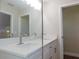 Double vanity bathroom with quartz countertop and a sleek design at 14268 Se 27Th Ct, Summerfield, FL 34491