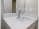 Modern bathroom featuring new faucet, quartz countertop, and spacious sink at 14268 Se 27Th Ct, Summerfield, FL 34491