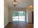 Bright dining room with sliding glass doors and hardwood floors at 14268 Se 27Th Ct, Summerfield, FL 34491