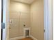 Practical laundry area with hookups and shelving for efficient home management at 14268 Se 27Th Ct, Summerfield, FL 34491