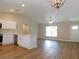 Open concept kitchen and living area with stainless steel appliances and an open floorplan at 14268 Se 27Th Ct, Summerfield, FL 34491