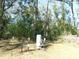Water well and pressure tank system including pressure switch and gauges in the side yard at 14268 Se 27Th Ct, Summerfield, FL 34491