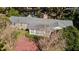 Aerial view of home showcasing the sunroom addition and brick patio at 1728 Se 8Th St, Ocala, FL 34471