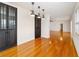 Dining room with hardwood floors and dark cabinetry at 1728 Se 8Th St, Ocala, FL 34471