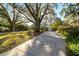 Long driveway leading to a charming house at 1728 Se 8Th St, Ocala, FL 34471