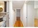 Hardwood floors in the hallway with built in storage at 1728 Se 8Th St, Ocala, FL 34471