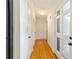 Hallway with hardwood floors and access to rooms at 1728 Se 8Th St, Ocala, FL 34471